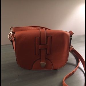 Small orange crossover bag